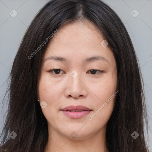 Joyful asian young-adult female with long  brown hair and brown eyes