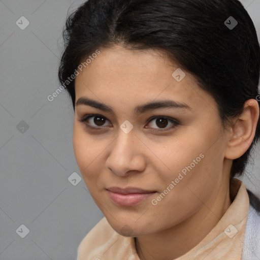 Joyful latino young-adult female with short  brown hair and brown eyes