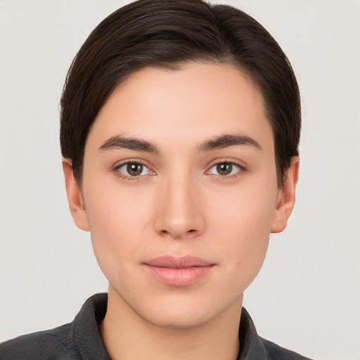 Neutral white young-adult female with short  brown hair and brown eyes