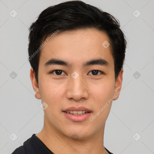 Joyful asian young-adult male with short  black hair and brown eyes