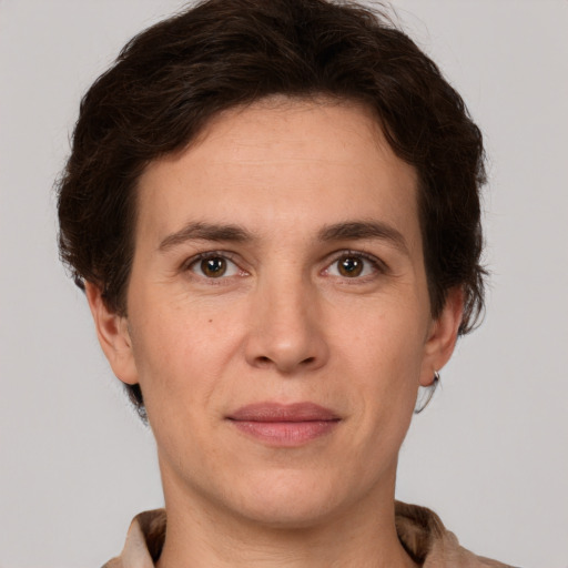 Joyful white adult female with short  brown hair and brown eyes