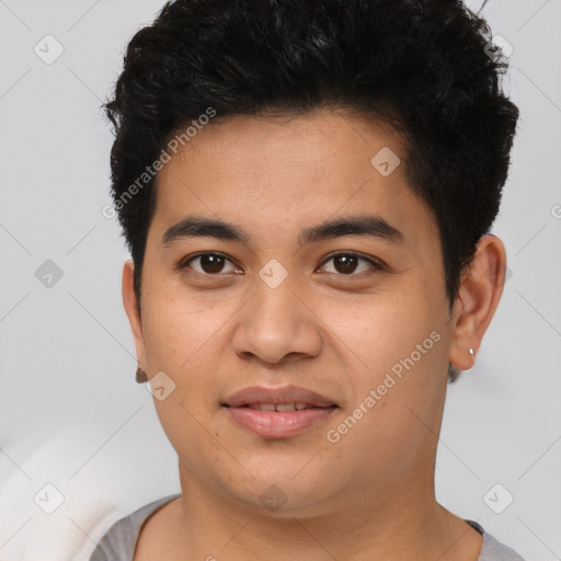 Joyful asian young-adult male with short  brown hair and brown eyes