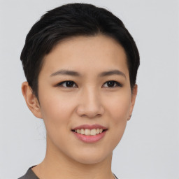 Joyful asian young-adult female with short  black hair and brown eyes