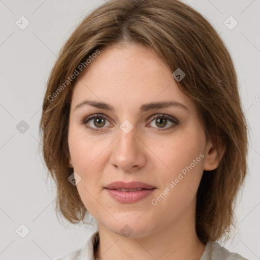 Joyful white young-adult female with medium  brown hair and green eyes