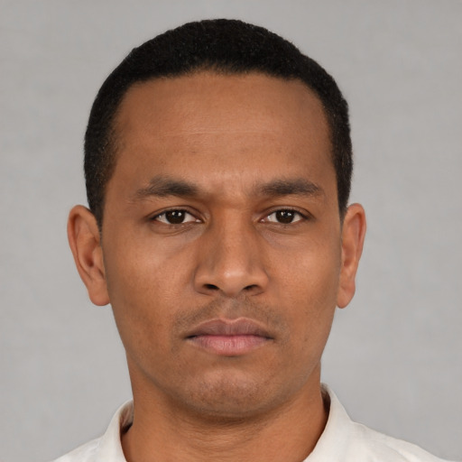 Neutral latino young-adult male with short  black hair and brown eyes