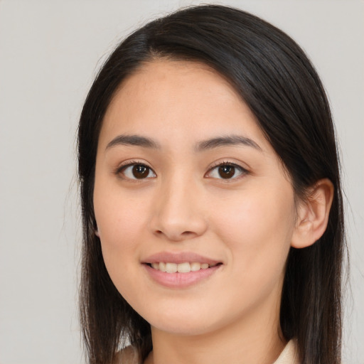 Joyful white young-adult female with long  brown hair and brown eyes