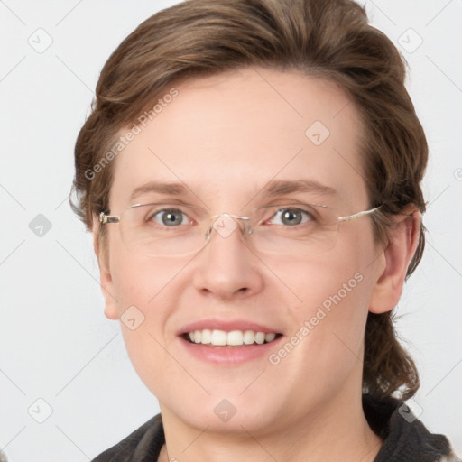 Joyful white adult female with medium  brown hair and green eyes