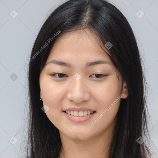 Joyful asian young-adult female with long  brown hair and brown eyes