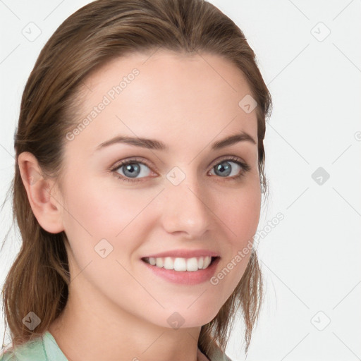 Joyful white young-adult female with long  brown hair and blue eyes