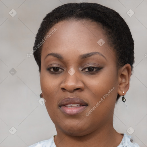 Joyful black young-adult female with short  brown hair and brown eyes