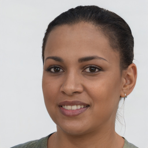 Joyful latino young-adult female with long  brown hair and brown eyes