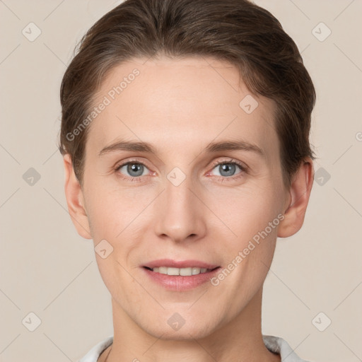 Joyful white young-adult female with short  brown hair and grey eyes