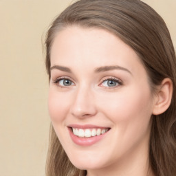 Joyful white young-adult female with long  brown hair and green eyes