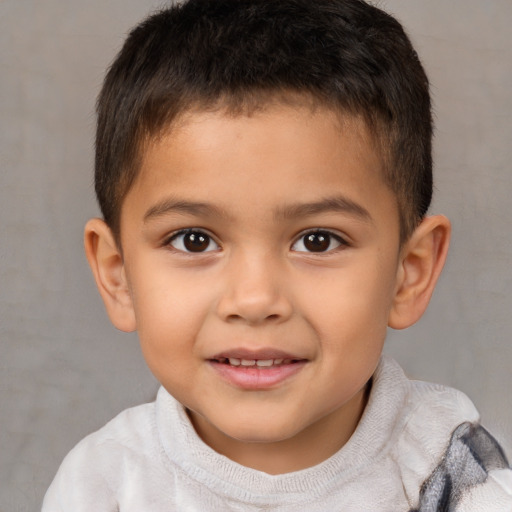 Joyful white child male with short  brown hair and brown eyes