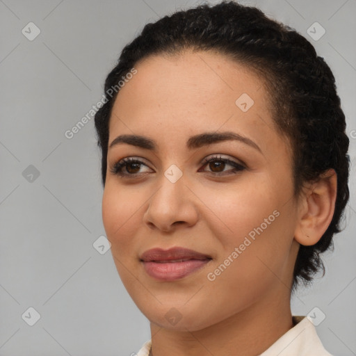 Joyful latino young-adult female with medium  brown hair and brown eyes