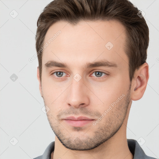 Neutral white young-adult male with short  brown hair and grey eyes