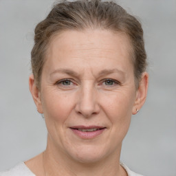 Joyful white adult female with short  brown hair and grey eyes