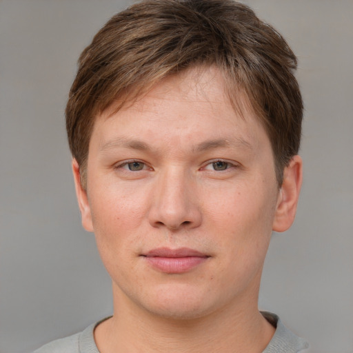 Joyful asian young-adult female with short  brown hair and grey eyes