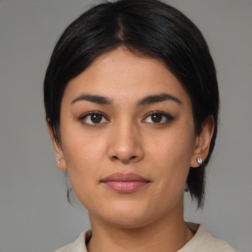 Joyful latino young-adult female with medium  black hair and brown eyes