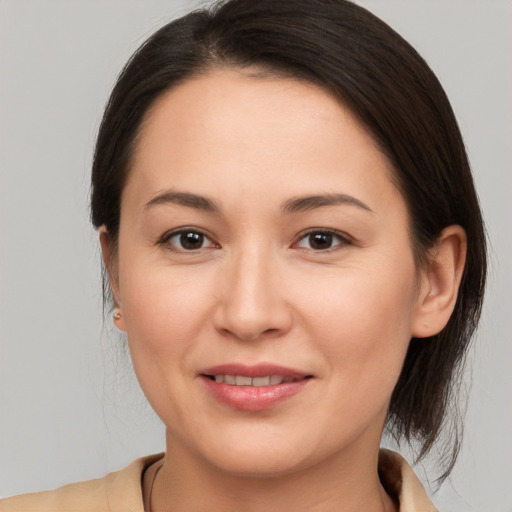 Joyful white young-adult female with medium  brown hair and brown eyes