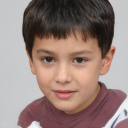 Joyful white child male with short  brown hair and brown eyes