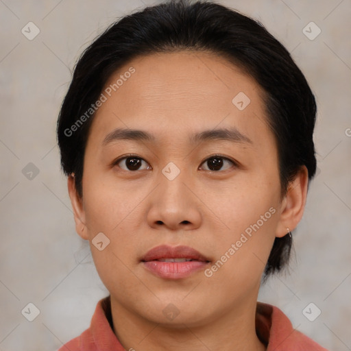 Joyful asian young-adult female with medium  brown hair and brown eyes