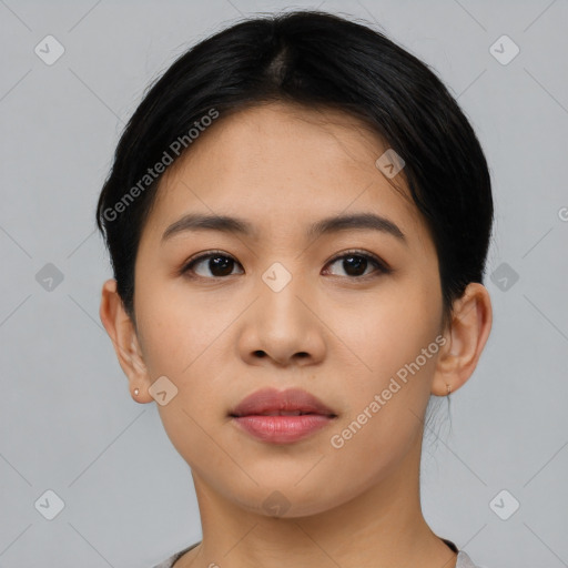 Joyful latino young-adult female with short  black hair and brown eyes