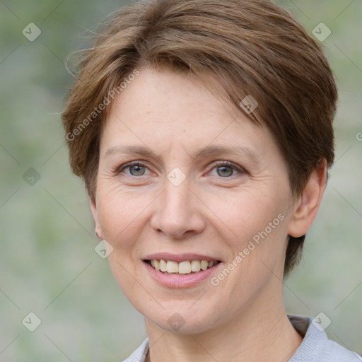 Joyful white adult female with short  brown hair and grey eyes