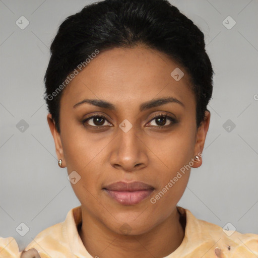 Joyful latino young-adult female with short  black hair and brown eyes