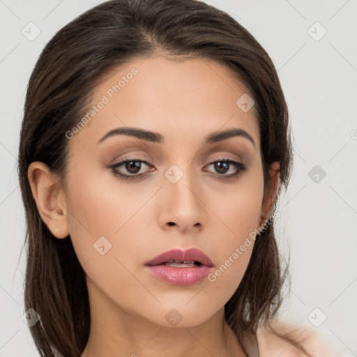 Neutral white young-adult female with long  brown hair and brown eyes