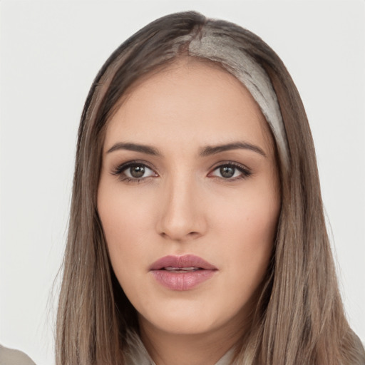 Neutral white young-adult female with long  brown hair and brown eyes