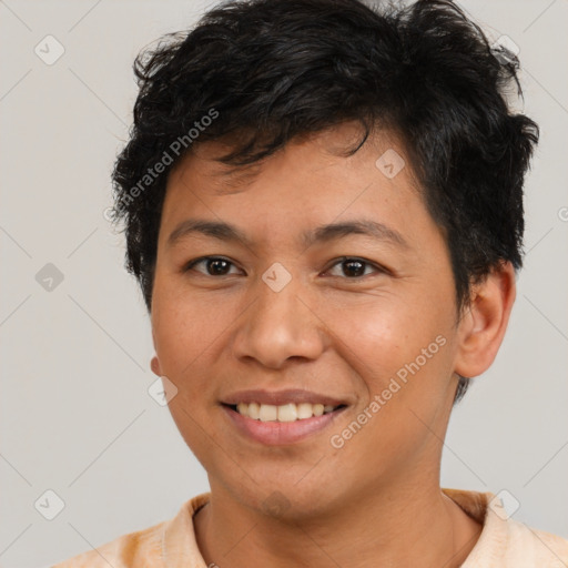 Joyful latino young-adult male with short  brown hair and brown eyes