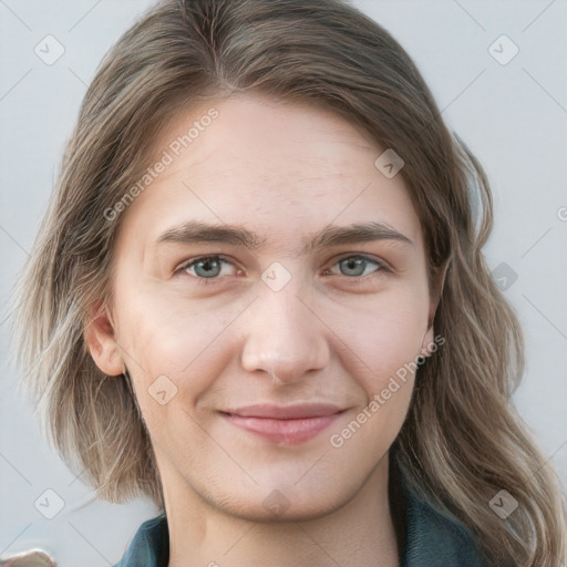 Joyful white young-adult female with medium  brown hair and blue eyes