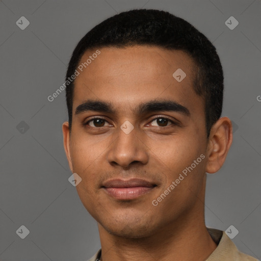 Joyful black young-adult male with short  black hair and brown eyes