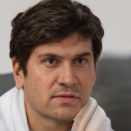 Neutral white adult male with short  brown hair and brown eyes