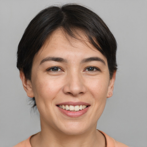 Joyful white young-adult female with medium  brown hair and brown eyes