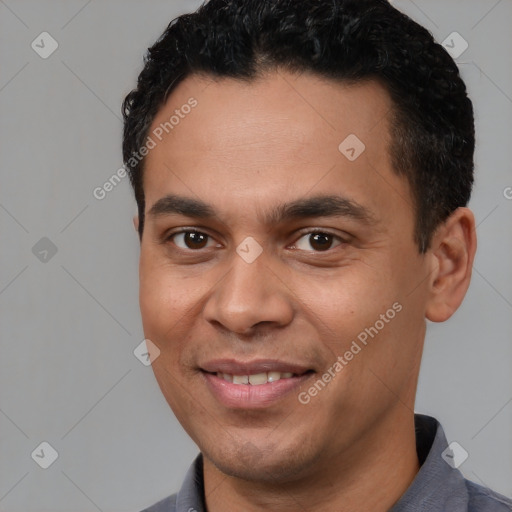 Joyful white young-adult male with short  black hair and brown eyes