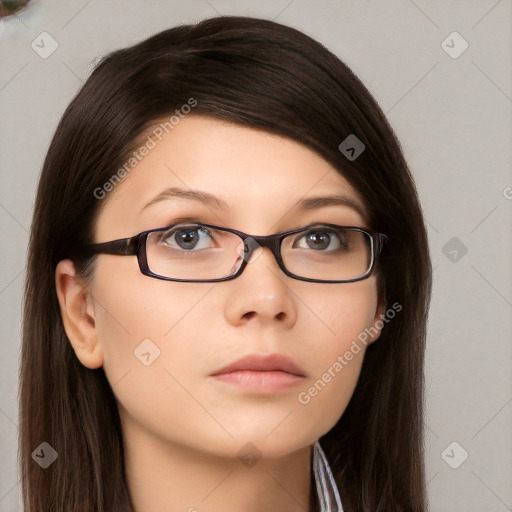 Neutral white young-adult female with long  brown hair and brown eyes