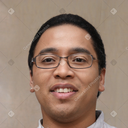 Joyful white young-adult male with short  black hair and brown eyes