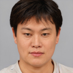 Neutral asian young-adult male with short  brown hair and brown eyes