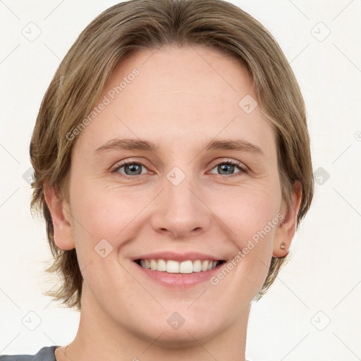 Joyful white young-adult female with medium  brown hair and green eyes