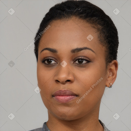 Joyful black young-adult female with short  black hair and brown eyes