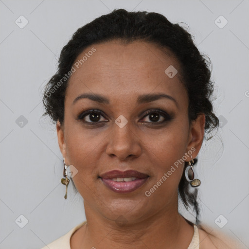 Joyful black adult female with short  brown hair and brown eyes