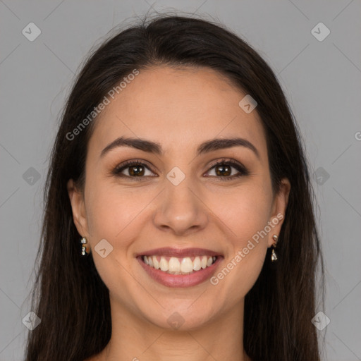 Joyful white young-adult female with long  brown hair and brown eyes