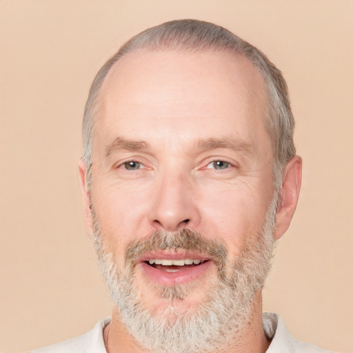 Joyful white middle-aged male with short  gray hair and brown eyes