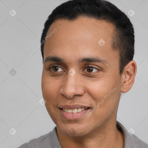 Joyful latino adult male with short  black hair and brown eyes