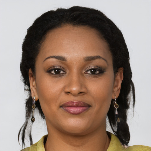 Joyful black young-adult female with medium  black hair and brown eyes