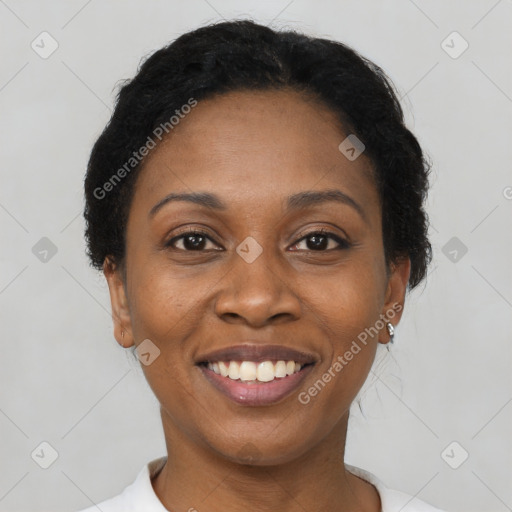 Joyful black adult female with short  brown hair and brown eyes