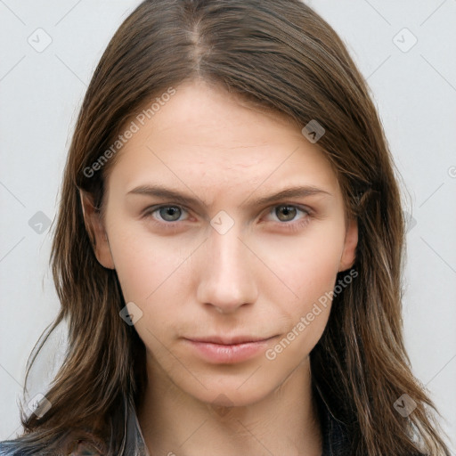Neutral white young-adult female with long  brown hair and brown eyes