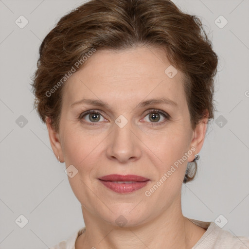 Joyful white adult female with short  brown hair and grey eyes